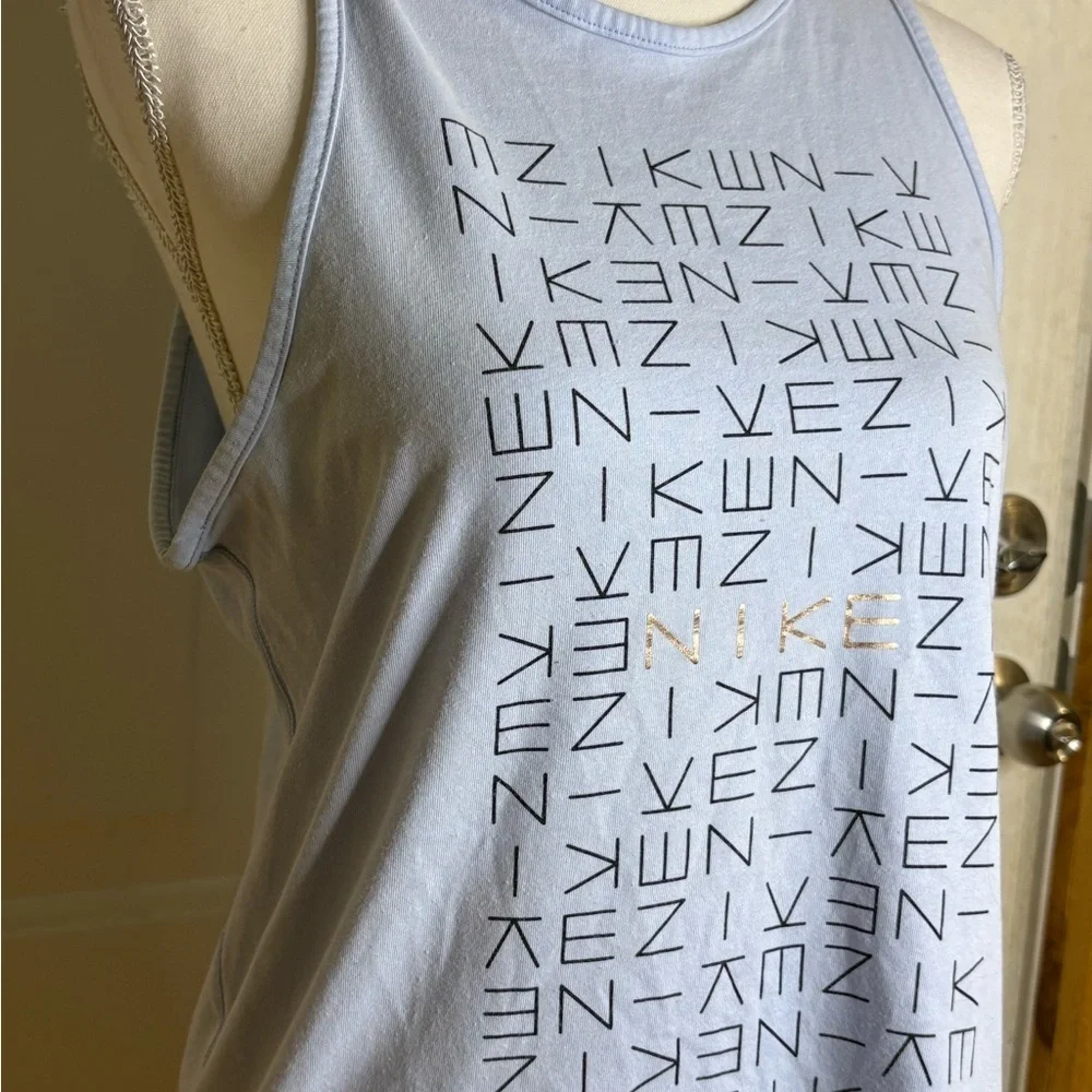 Nike light blue tank top with logo pattern. Size Medium.